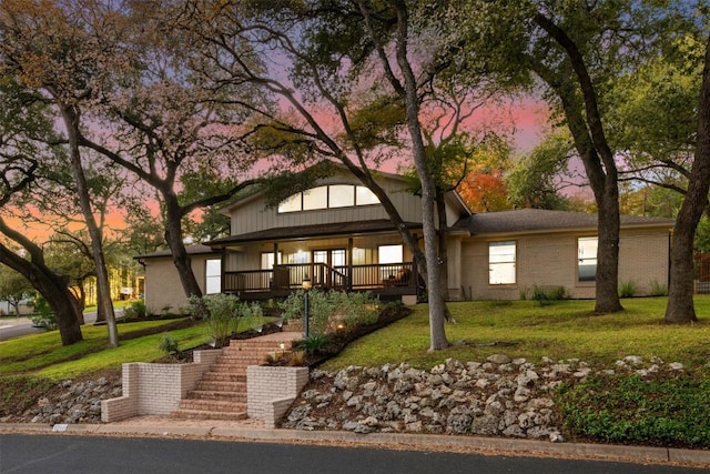 view of front of property with a lawn