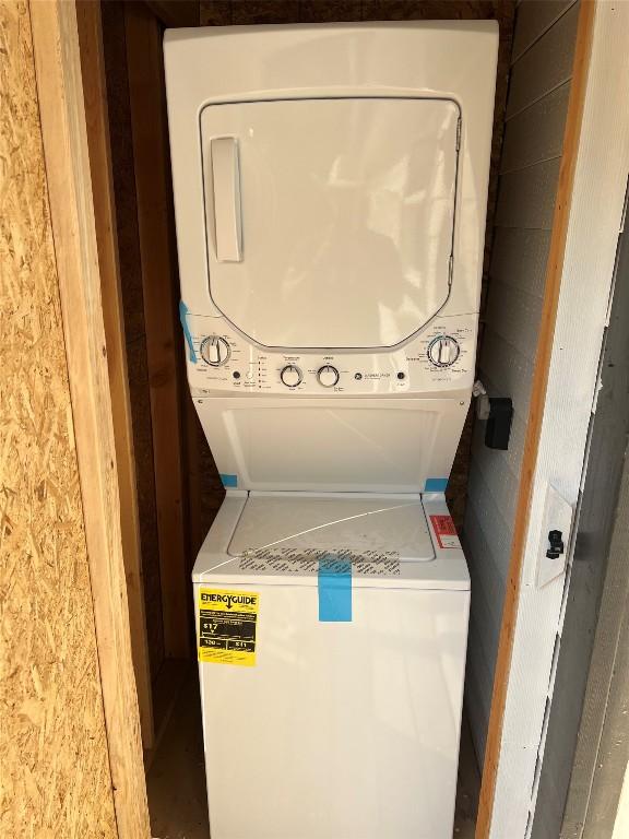 washroom with stacked washer and dryer