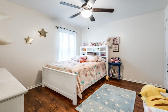 bedroom featuring dark hardwood / wood-style flooring and ceiling fan