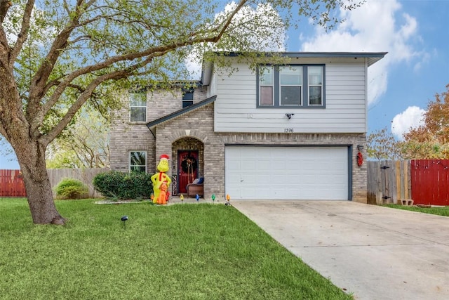 view of front of home with a front yard and a garage