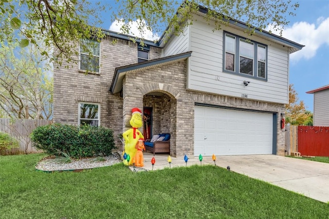 view of front of home with a front lawn and a garage