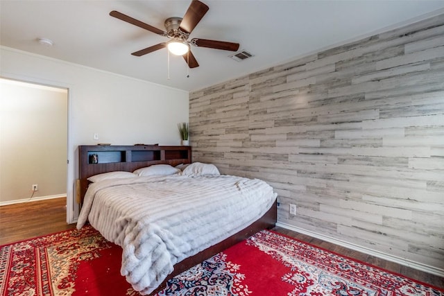 bedroom with hardwood / wood-style floors and ceiling fan