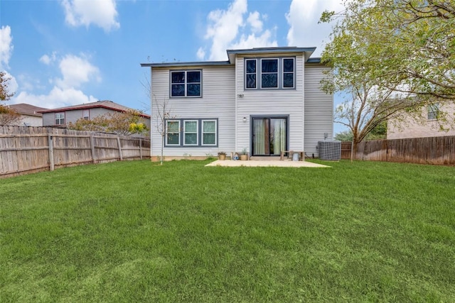 rear view of house with a lawn