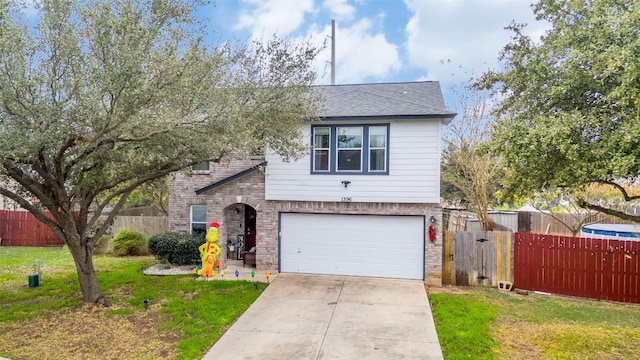 view of front facade with a front lawn and a garage