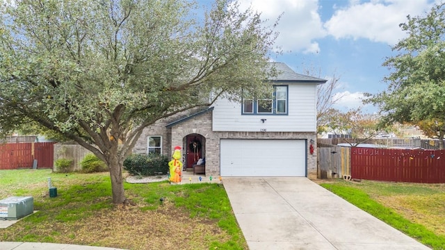 view of front of home featuring a front yard and a garage