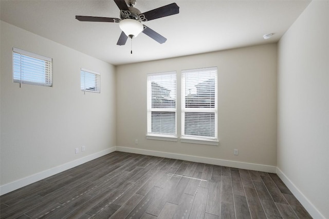 empty room featuring dark hardwood / wood-style floors and ceiling fan