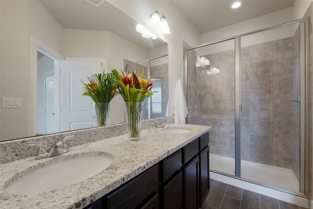 bathroom with vanity and an enclosed shower