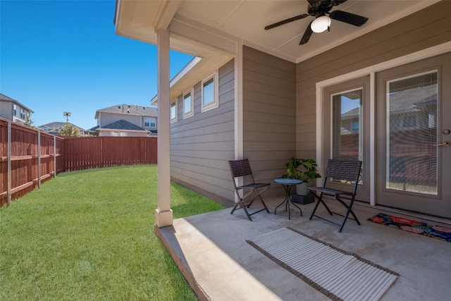 view of yard featuring ceiling fan and a patio area