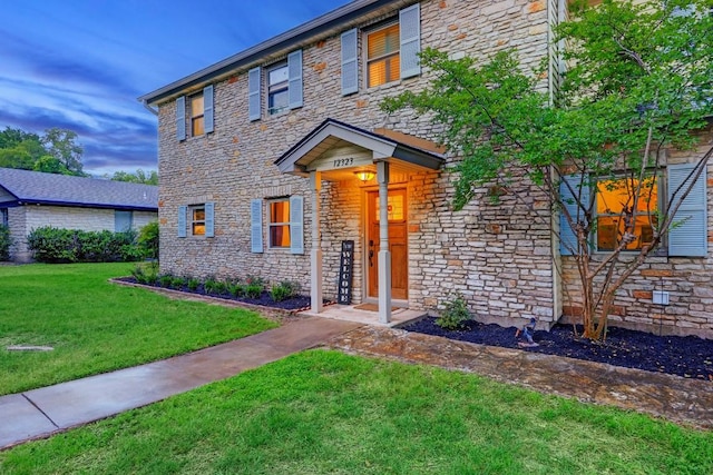 12323 Blue Water Dr, Austin, TX 78758 - view of front of home featuring stone siding and a front yard