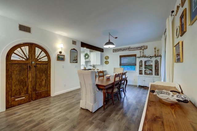 dining space featuring dark hardwood / wood-style floors