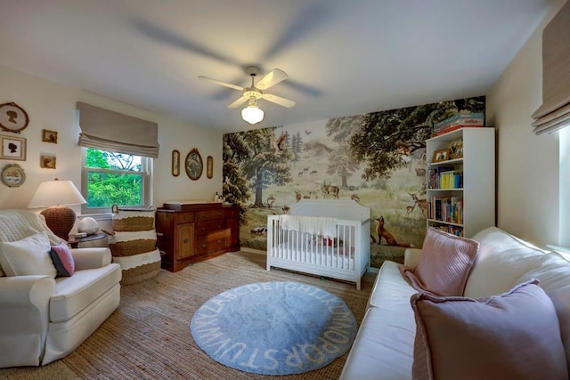 12323 Blue Water Dr, Austin, TX 78758 - bedroom with wallpapered walls, an accent wall, light colored carpet, and a ceiling fan