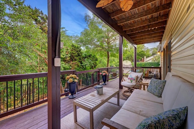 deck featuring an outdoor living space and ceiling fan