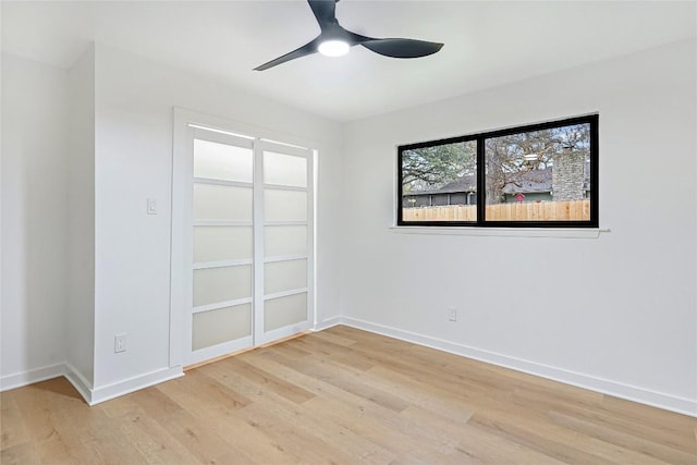 unfurnished room with light hardwood / wood-style flooring and ceiling fan