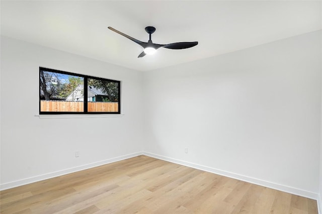 empty room with light hardwood / wood-style flooring and ceiling fan