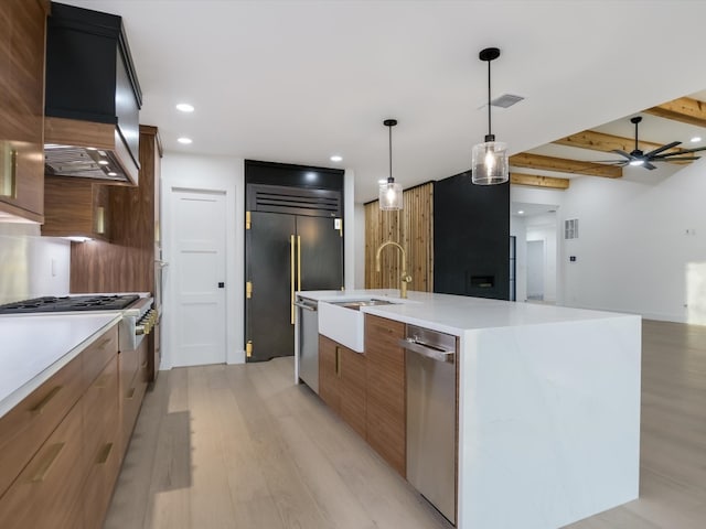 kitchen featuring ceiling fan, hanging light fixtures, beamed ceiling, custom range hood, and appliances with stainless steel finishes