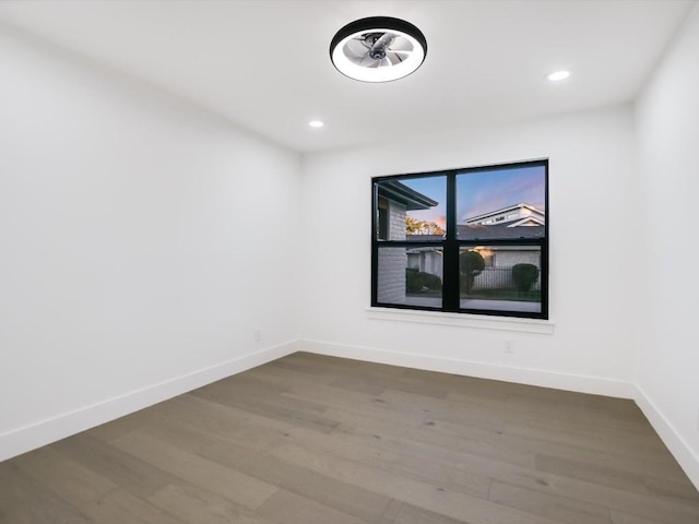 spare room featuring hardwood / wood-style floors