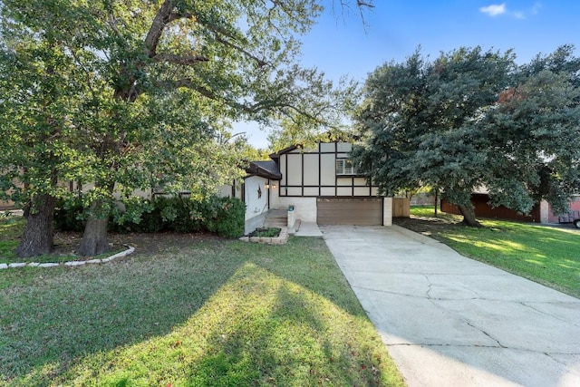 view of front of house with a garage and a front yard