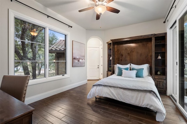 bedroom featuring ceiling fan and dark wood-type flooring