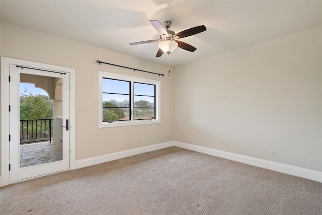 unfurnished room with light carpet and ceiling fan