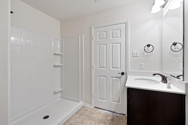 bathroom featuring vanity and walk in shower