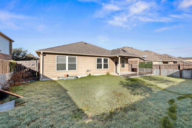 back of property featuring a patio area and a lawn