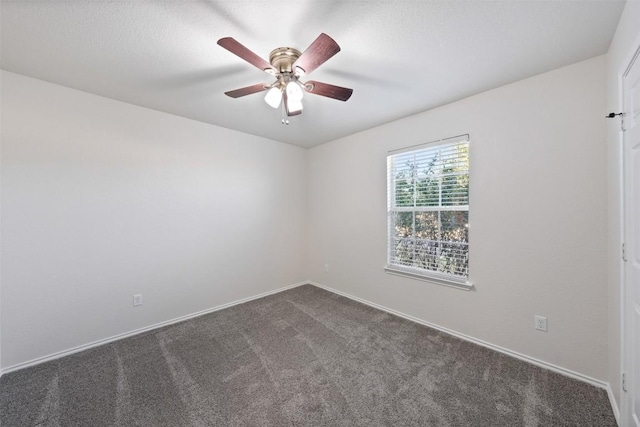 unfurnished room featuring ceiling fan and carpet