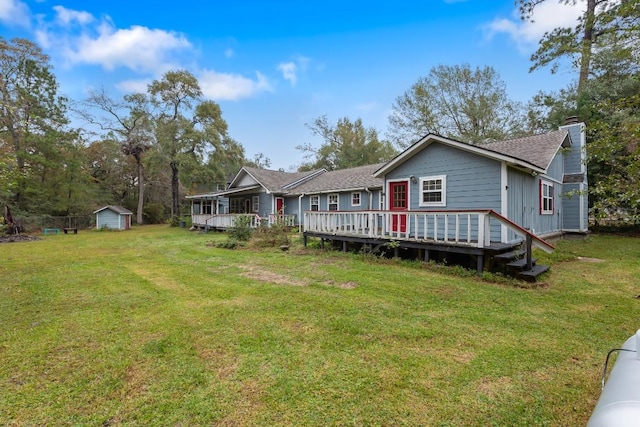 20024 W Lakeshore Dr, Magnolia, TX 77355 - rear view of property featuring a chimney, a storage shed, a lawn, and a wooden deck