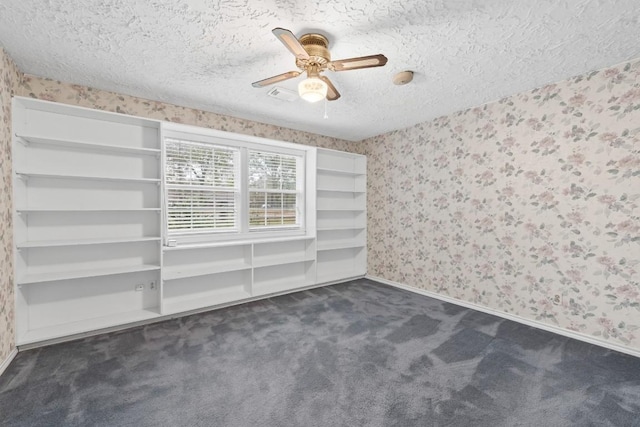 20024 W Lakeshore Dr, Magnolia, TX 77355 - unfurnished room with wallpapered walls, dark carpet, a textured ceiling, and ceiling fan