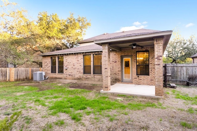 11125 Bastogne Loop, Austin, TX 78739 - back of house with ceiling fan, a patio, a fenced backyard, and brick siding