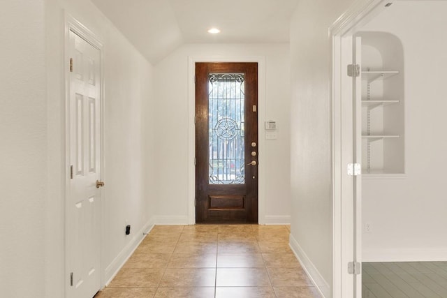 11125 Bastogne Loop, Austin, TX 78739 - foyer featuring light tile patterned floors and vaulted ceiling