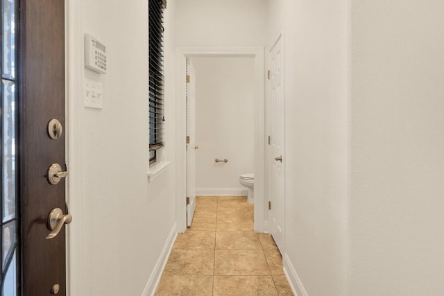 11125 Bastogne Loop, Austin, TX 78739 - hallway featuring light tile patterned floors and baseboards