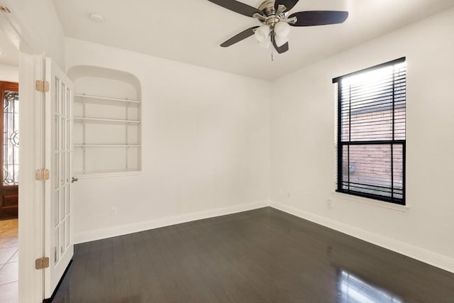 11125 Bastogne Loop, Austin, TX 78739 - unfurnished room with dark wood-type flooring, ceiling fan, arched walkways, and a smoke detector