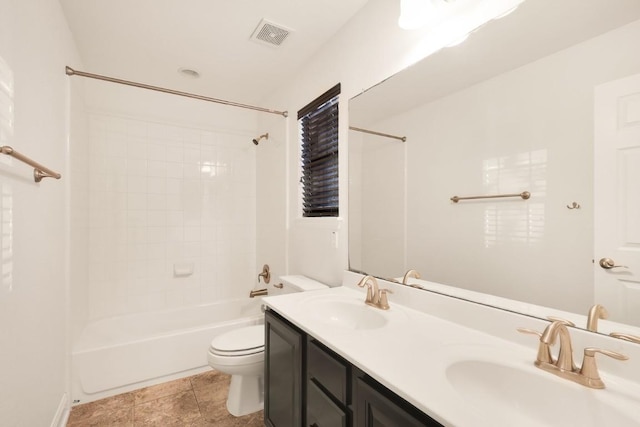 full bathroom featuring tile patterned floors, toilet, vanity, and washtub / shower combination