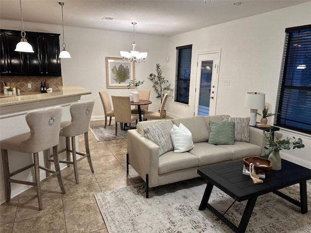 11125 Bastogne Loop, Austin, TX 78739 - living area featuring a chandelier and baseboards