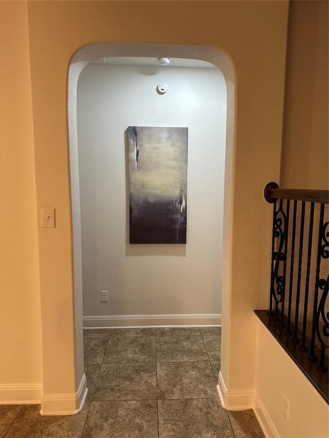 11125 Bastogne Loop, Austin, TX 78739 - corridor featuring arched walkways and tile patterned flooring