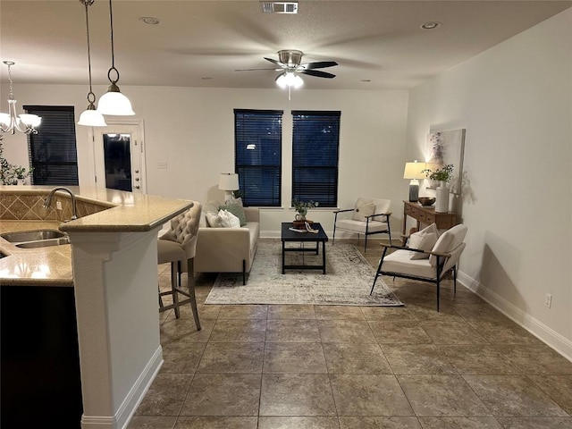 11125 Bastogne Loop, Austin, TX 78739 - living area featuring ceiling fan and a chandelier