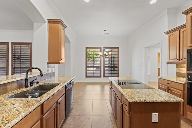 kitchen with black appliances, sink, hanging light fixtures, ornamental molding, and a notable chandelier