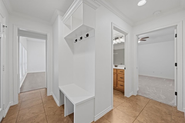 mudroom featuring light tile patterned floors, ceiling fan, and ornamental molding