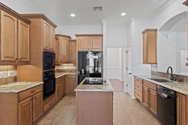 kitchen featuring black appliances, crown molding, sink, light tile patterned flooring, and light stone counters