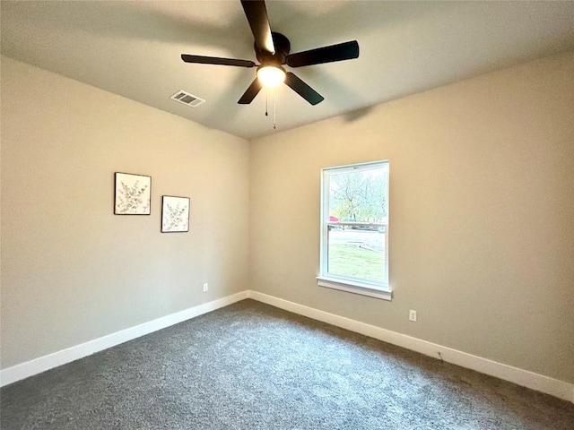 carpeted empty room featuring ceiling fan