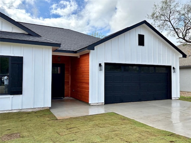 view of front of property with a front lawn and a garage