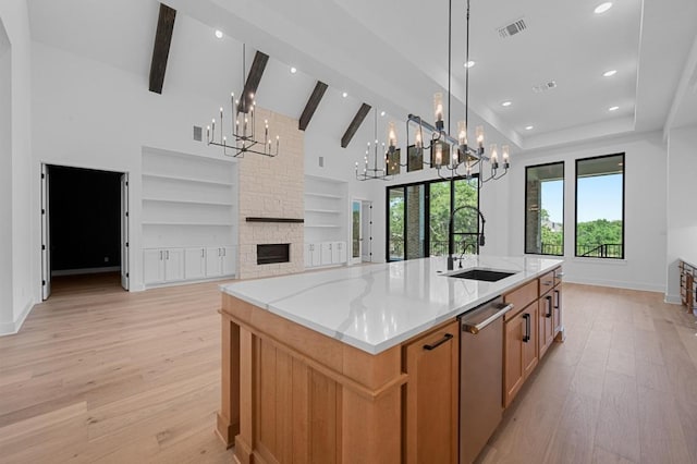 790 Old Stone Rd, Austin, TX 78737 - kitchen featuring a chandelier, stainless steel dishwasher, light wood finished floors, a sink, and recessed lighting