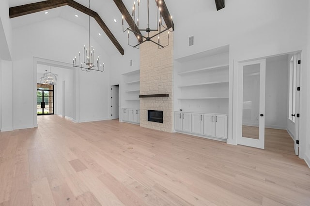 790 Old Stone Rd, Austin, TX 78737 - unfurnished living room featuring a chandelier, high vaulted ceiling, beam ceiling, a fireplace, and recessed lighting