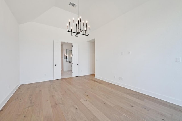 790 Old Stone Rd, Austin, TX 78737 - unfurnished dining area with a chandelier, light wood-type flooring, baseboards, and lofted ceiling