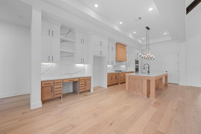 790 Old Stone Rd, Austin, TX 78737 - kitchen with open shelves, a sink, light countertops, light wood-type flooring, and recessed lighting