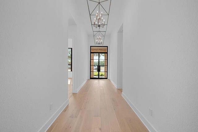 790 Old Stone Rd, Austin, TX 78737 - hall with a chandelier, light wood-type flooring, and a high ceiling