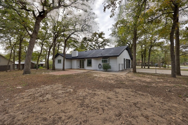 rear view of property featuring a patio area