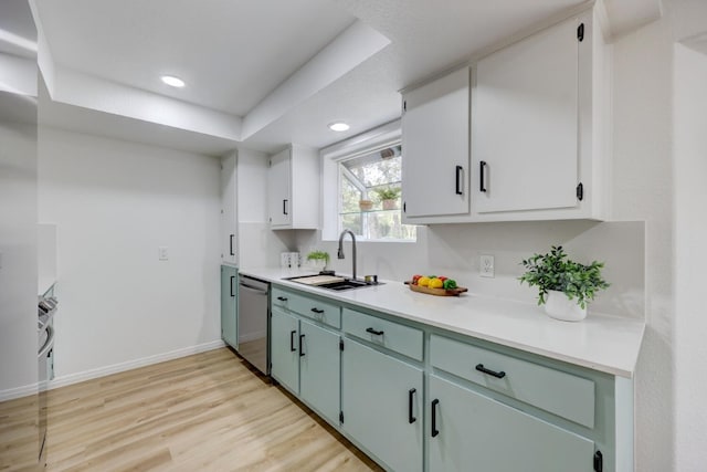 kitchen with light wood-type flooring, sink, green cabinetry, dishwasher, and white cabinetry