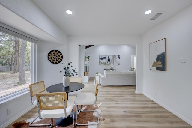 dining space featuring light wood-type flooring