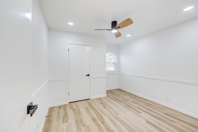 unfurnished room featuring ceiling fan and light hardwood / wood-style floors